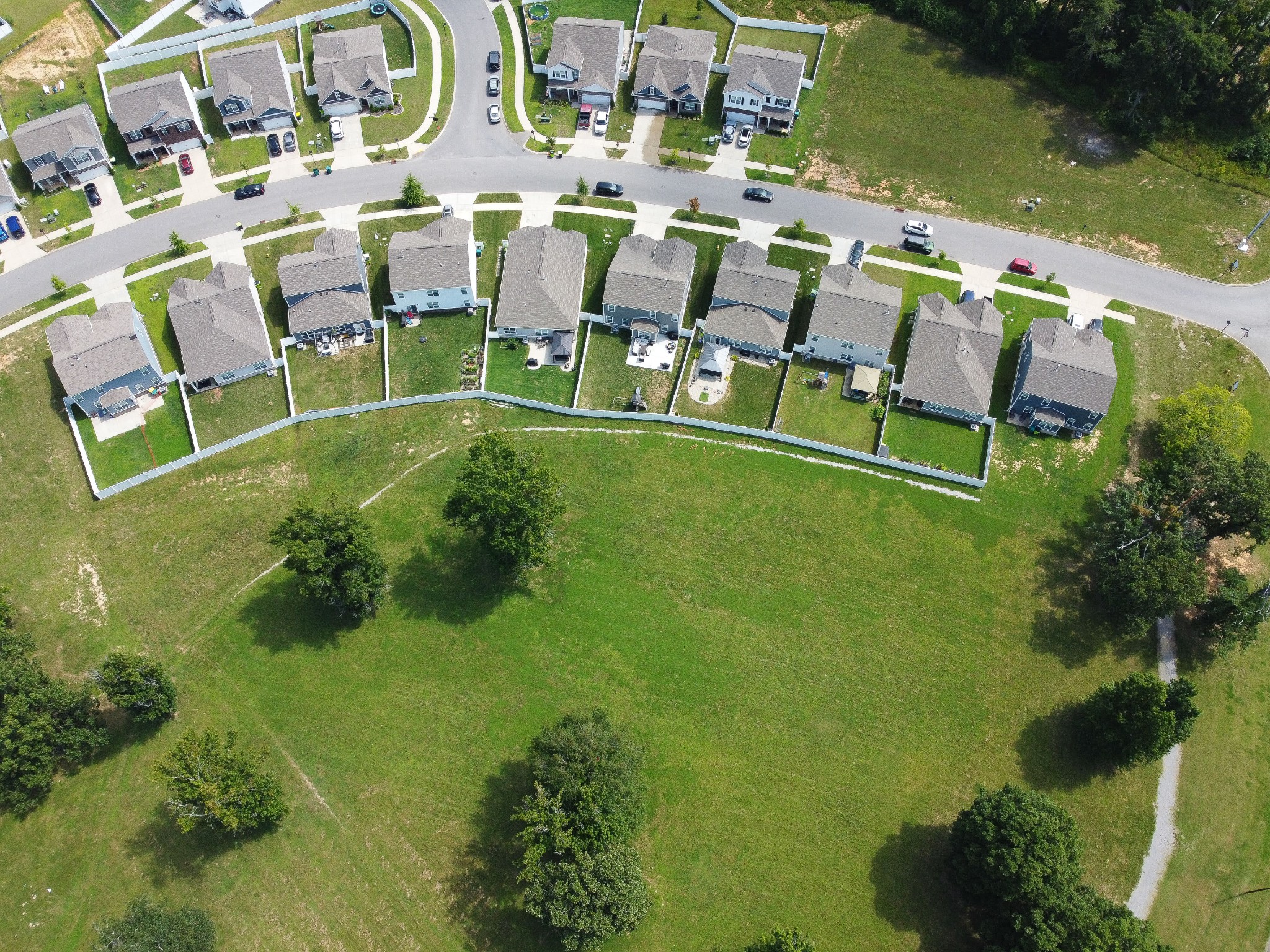 Aerial view of the home beside community green space